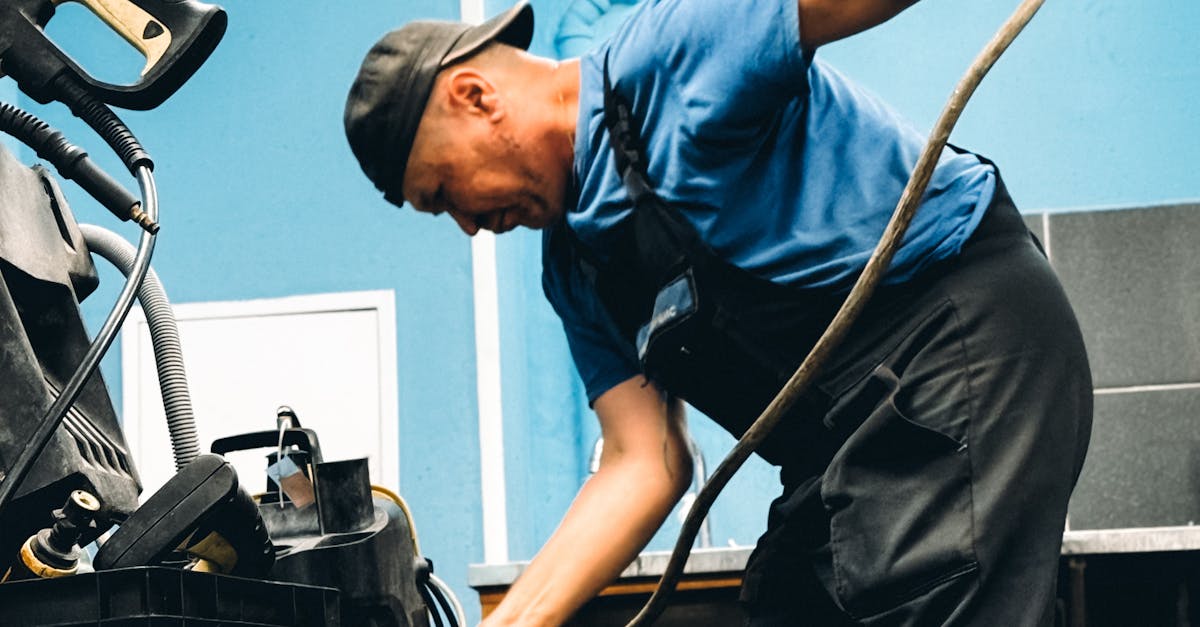 Licensed emergency plumber fixing burst pipe