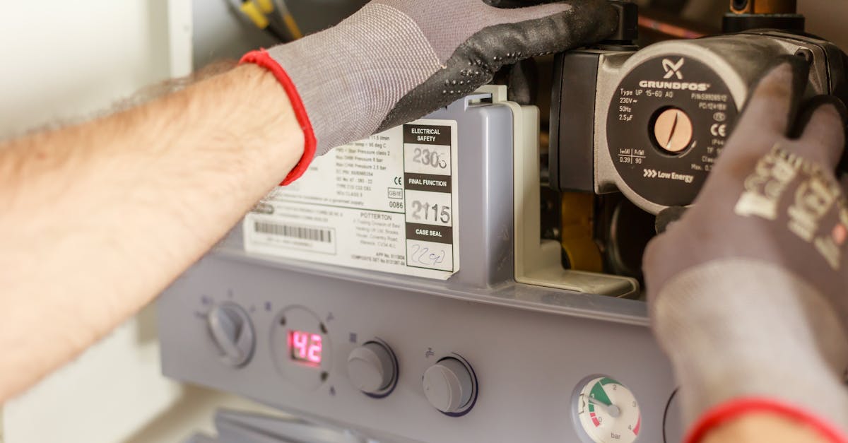 Licensed plumber repairing water heater