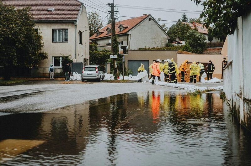 Emergency sewer backup repair — plumber clearing sewer line